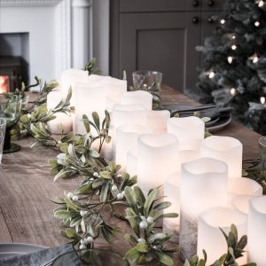 LED candles with greenery Christmas table runner