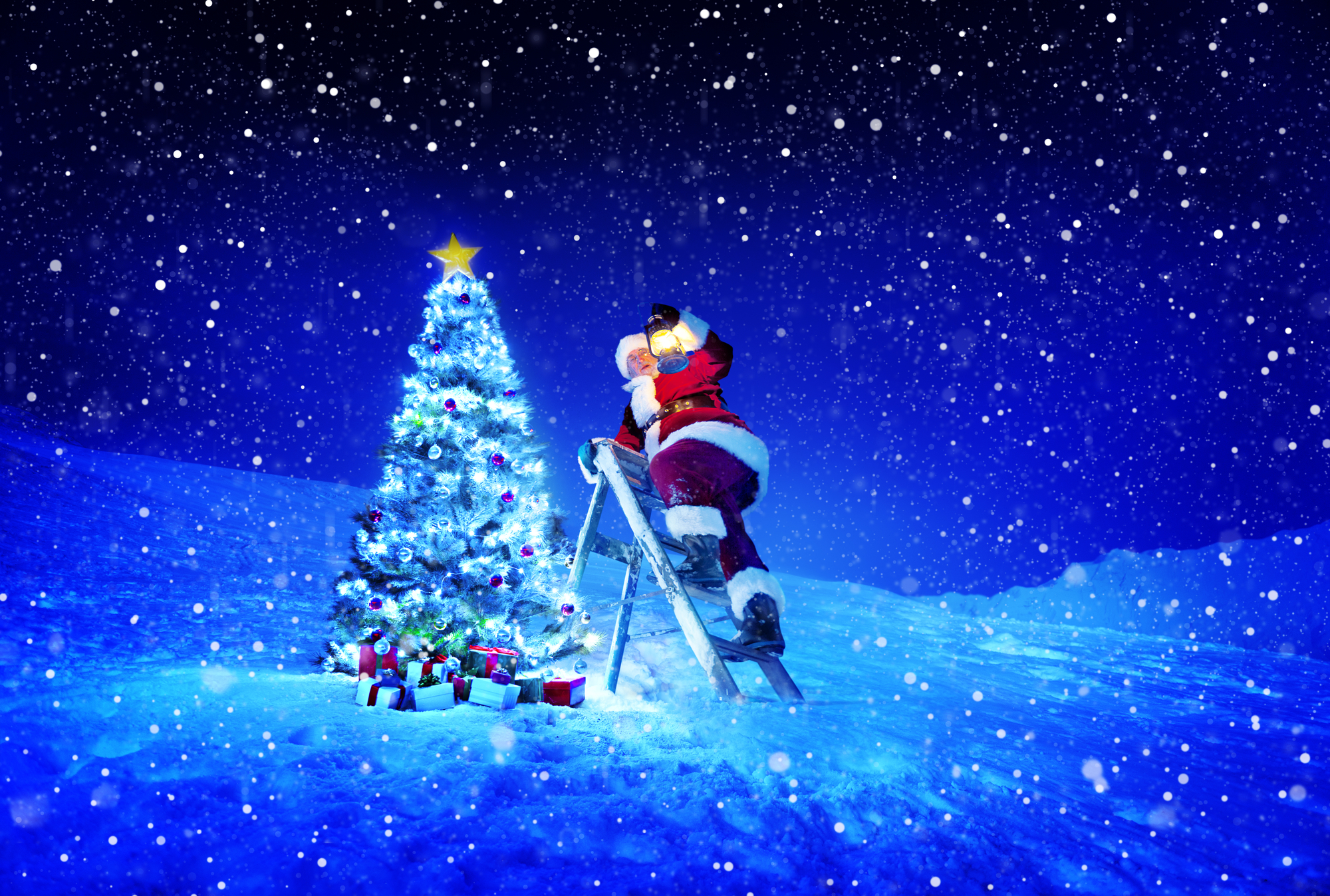 Santa Claus skiing near a Christmas tree at 34 Market Place.