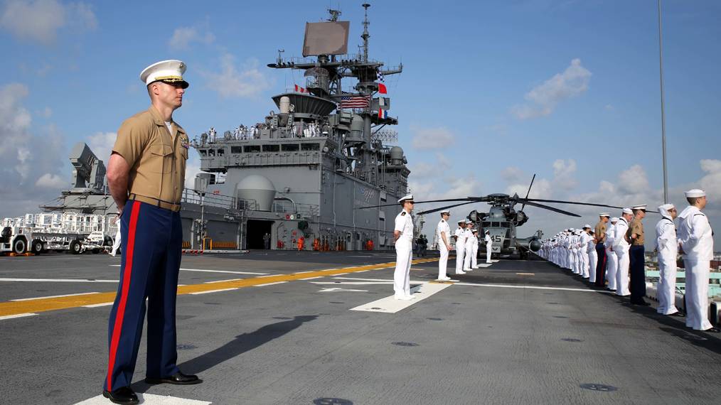 A marine standing on the deck of a ship.